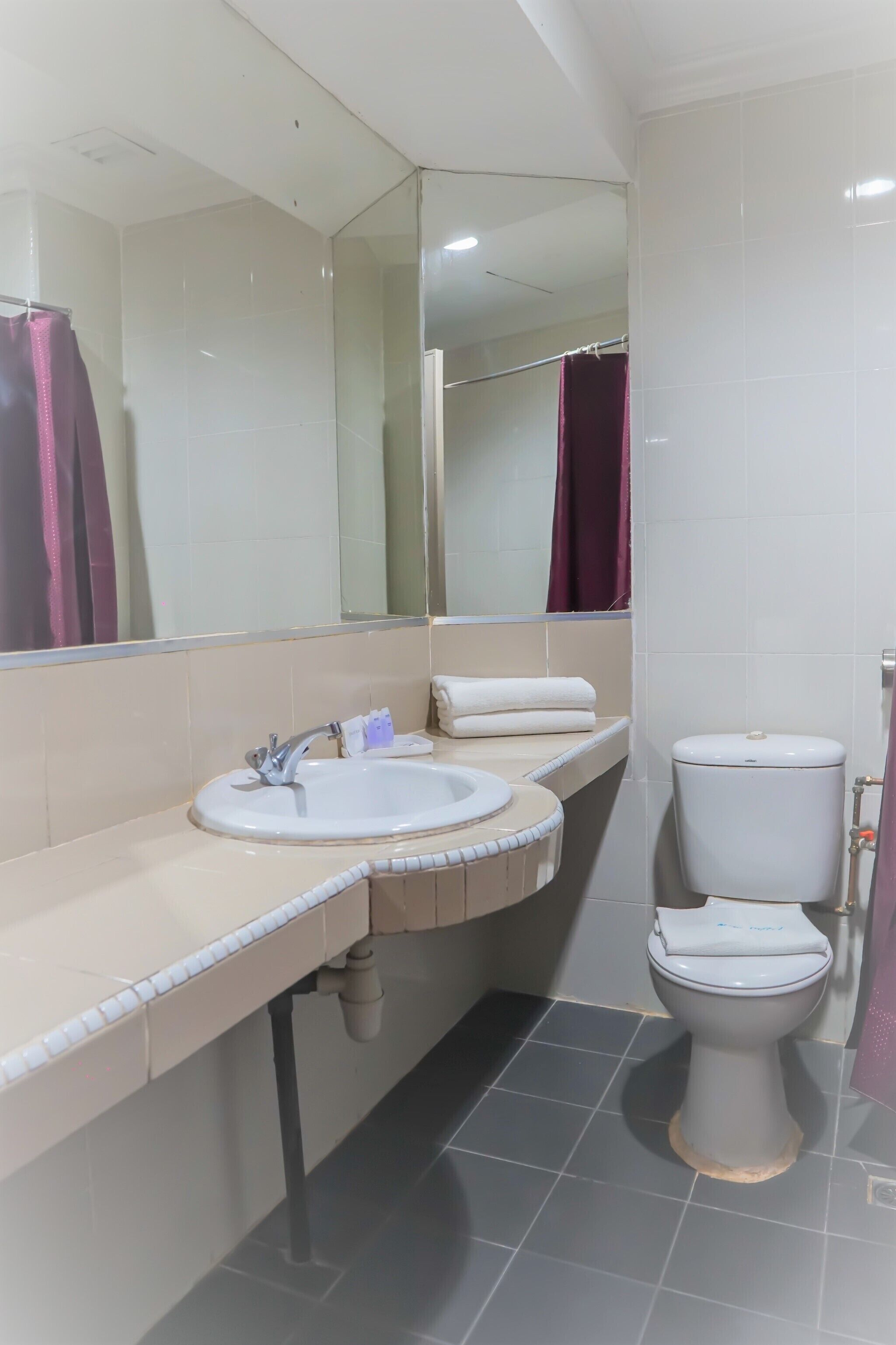 family suite | bathroom | shower, slippers, bidet, towels