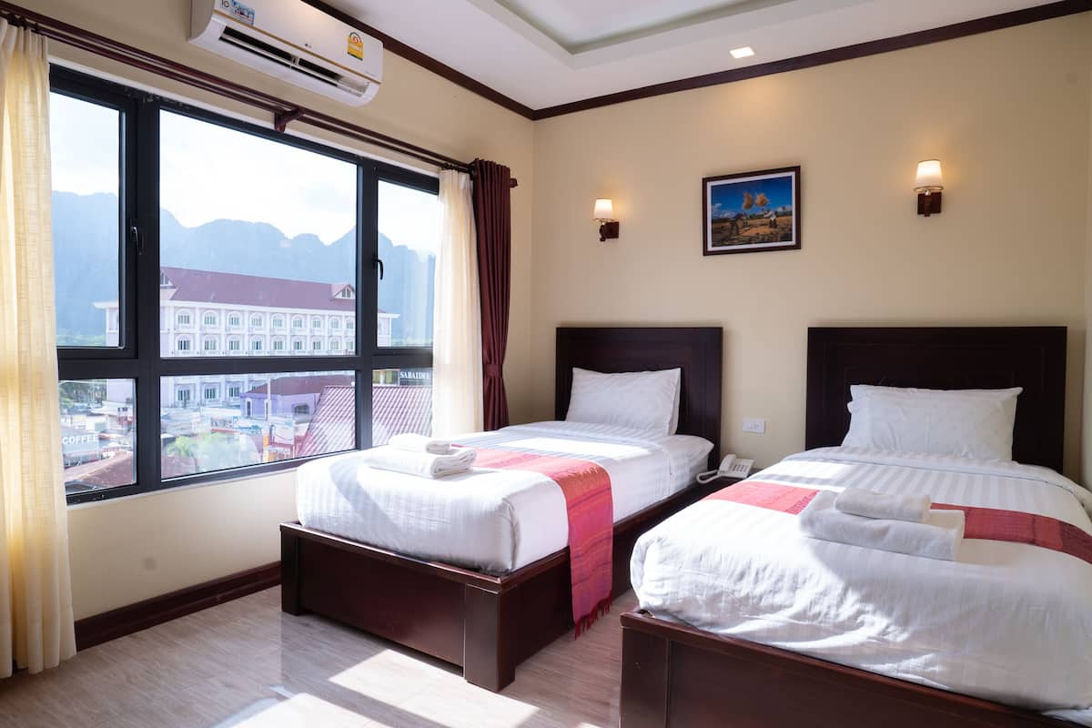 superior twin room | minibar, in-room safe, desk, blackout curtains