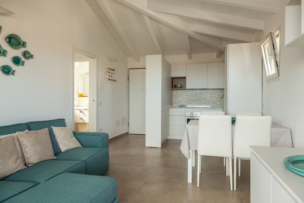 Elite-Apartment, 1 Schlafzimmer | Wohnbereich | Flachbildfernseher