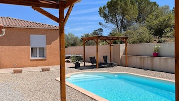 Seasonal outdoor pool, open 9:00 AM to 8:00 PM, pool umbrellas