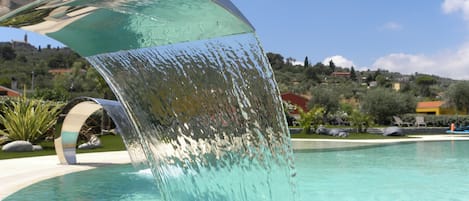 Seasonal outdoor pool, pool umbrellas, pool loungers