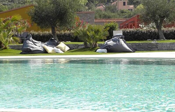 Seasonal outdoor pool, pool umbrellas, pool loungers