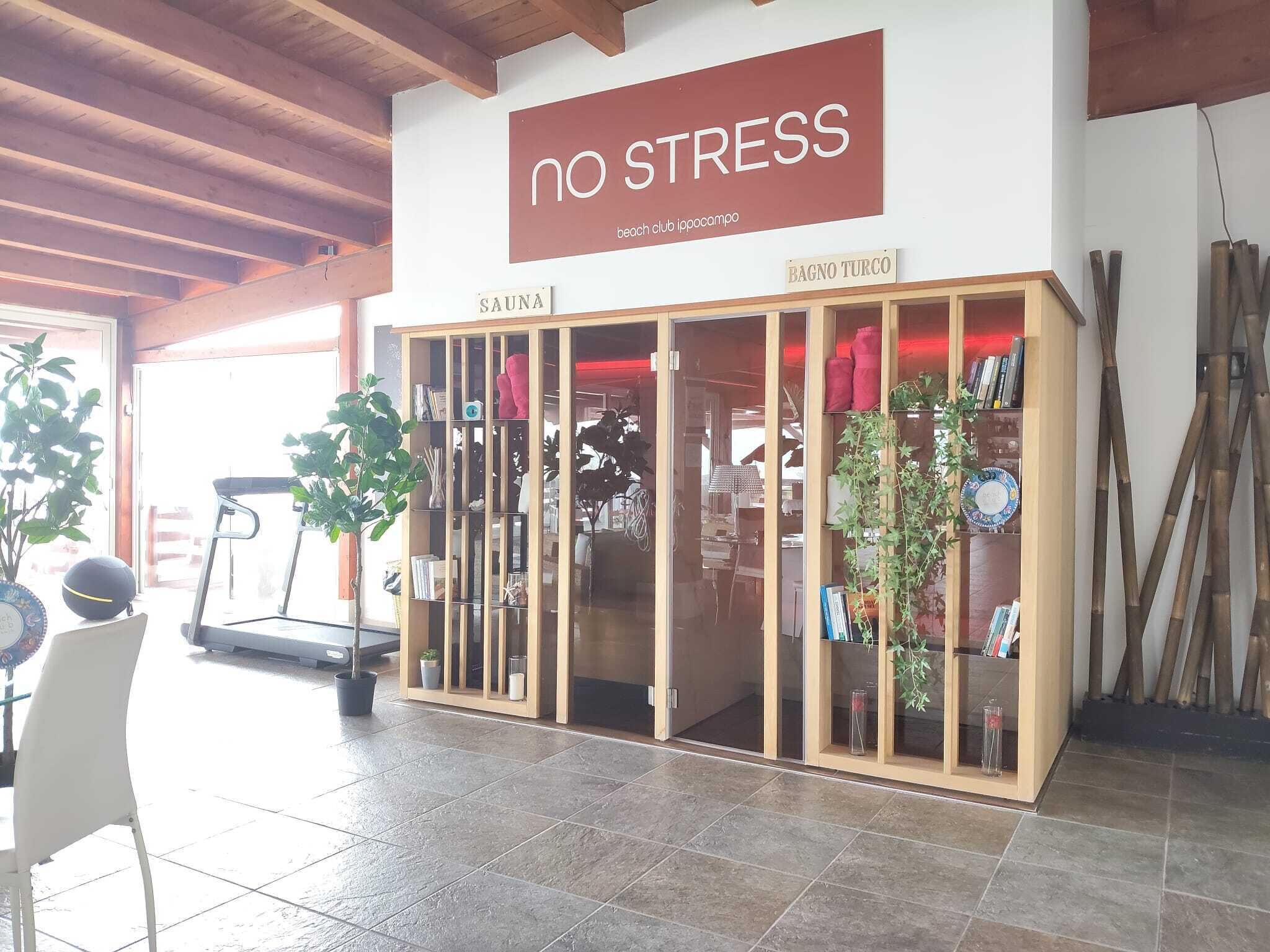 A wellness center with a sign reading 'no stress' and a sauna section.
