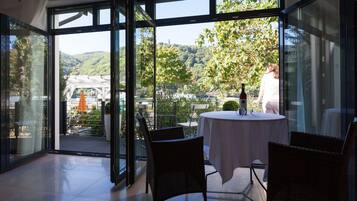 Suite, River View | Living room | Flat-screen TV