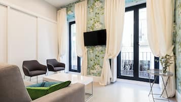 Apartment, 1 Bedroom (Exterior) | Living area | Flat-screen TV