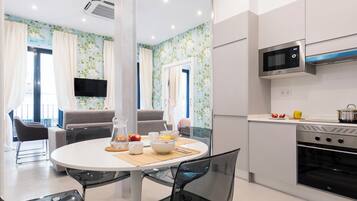 Apartment, 1 Bedroom (Exterior) | Living area | Flat-screen TV