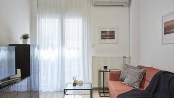 Apartment, 1 Bedroom | Living room | Flat-screen TV