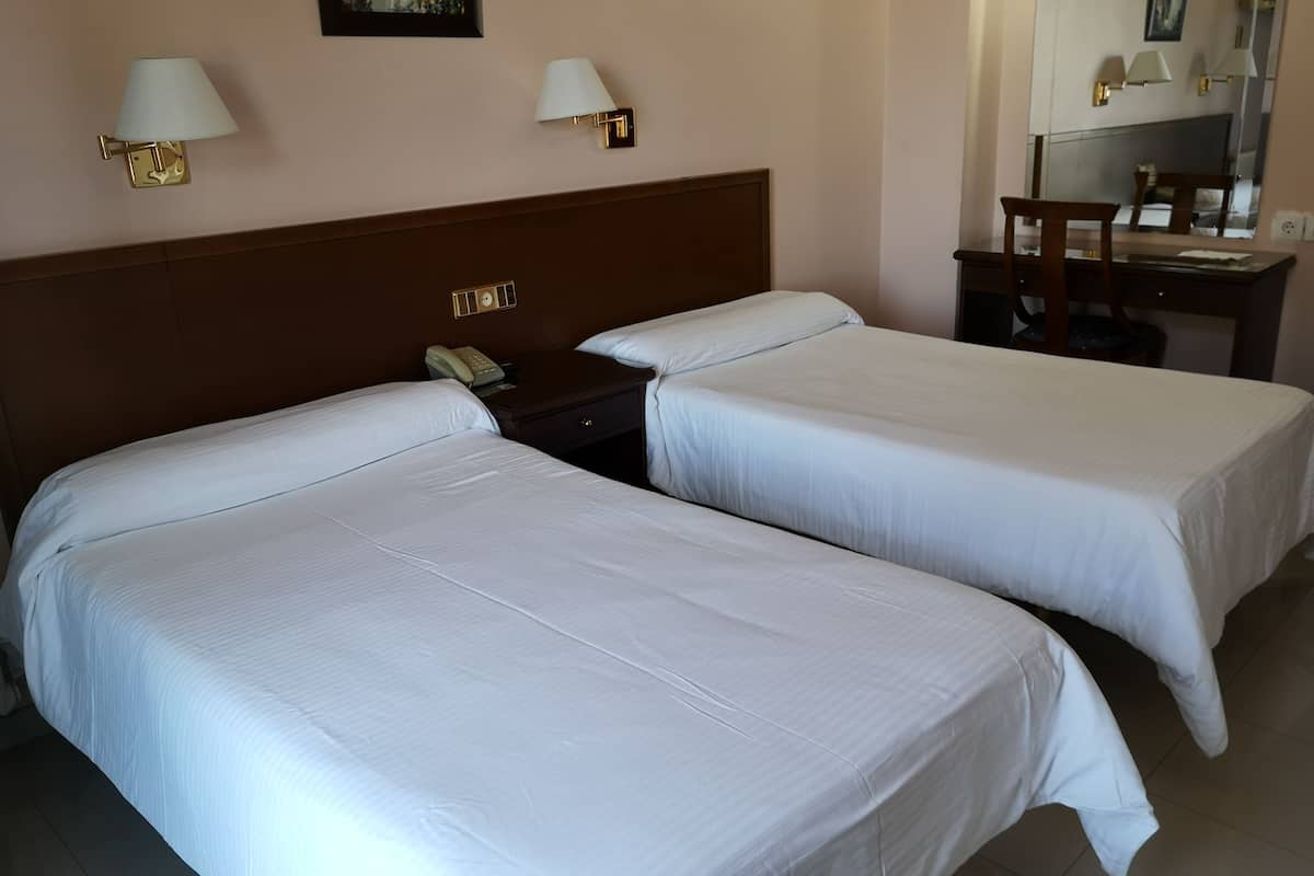 double or twin room | desk, blackout curtains, cots/infant beds, rollaway beds