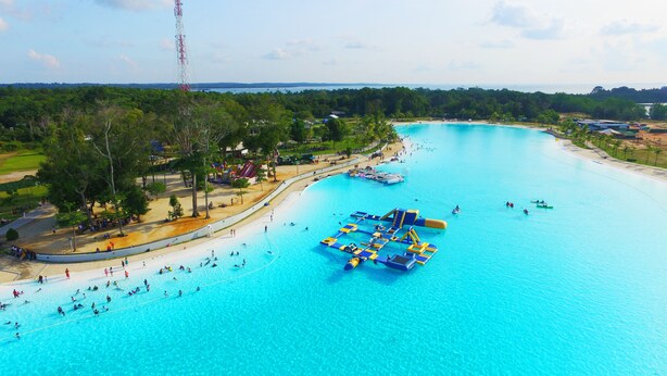 A large water park with multiple swimming areas and water slides. - The ANMON Resort Bintan- Glamping (Bintan)