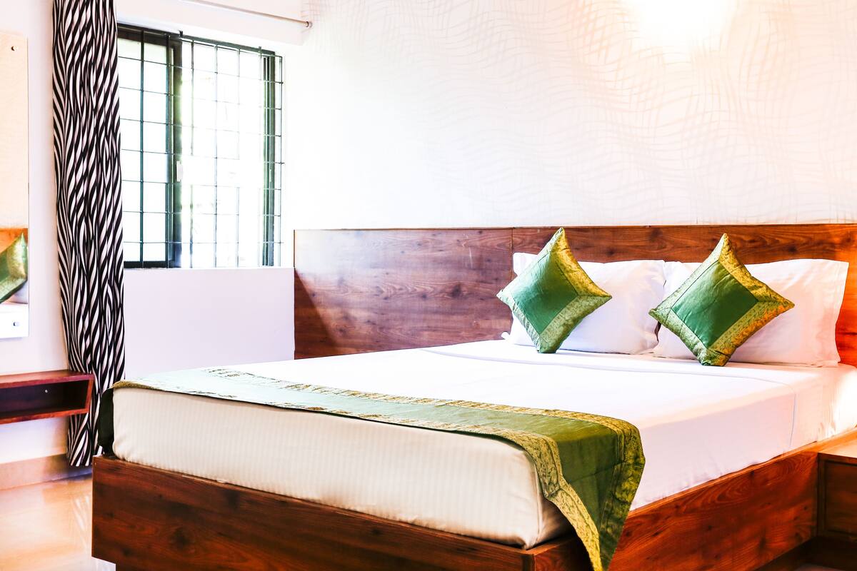 Habitación Premium | Tabla de planchar con plancha, camas extra, wifi gratis y ropa de cama 