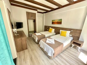 Economy Double Room, 1 Queen Bed, Non Smoking | 1 bedroom, iron/ironing board, free WiFi, bed sheets