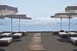 On the beach, sun loungers
