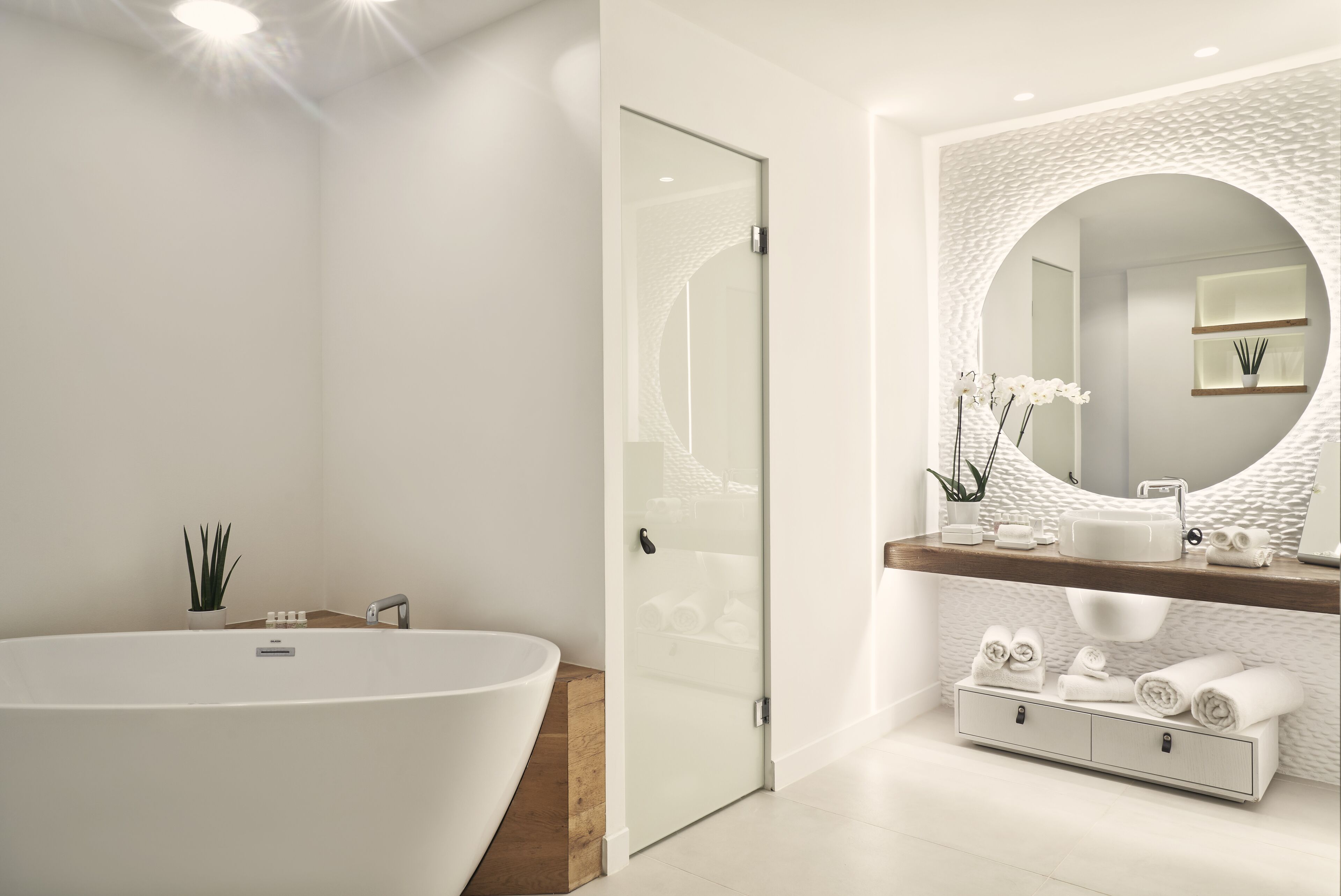 designer toiletries, hair dryer, bathrobes, slippers