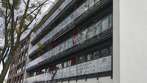 A multi-story building with a white facade, large windows, and balconies. - Praga Elegant Studio (Warsaw)