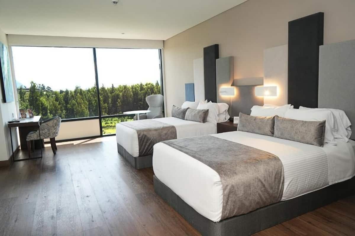 deluxe room, 2 double beds | 1 bedroom, minibar, in-room safe, desk