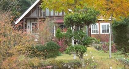 Log guest house with wide lawn garden