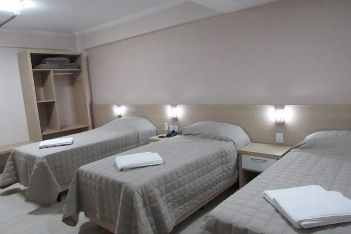 triple room | minibar, in-room safe, desk, blackout curtains