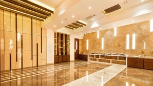 A spacious lobby with a polished marble floor, a central walkway, and modern lighting fixtures. - Hotel Wego (Mumbai)