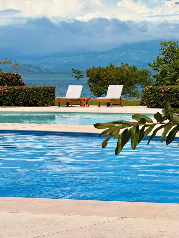 2 outdoor pools, pool umbrellas, pool loungers