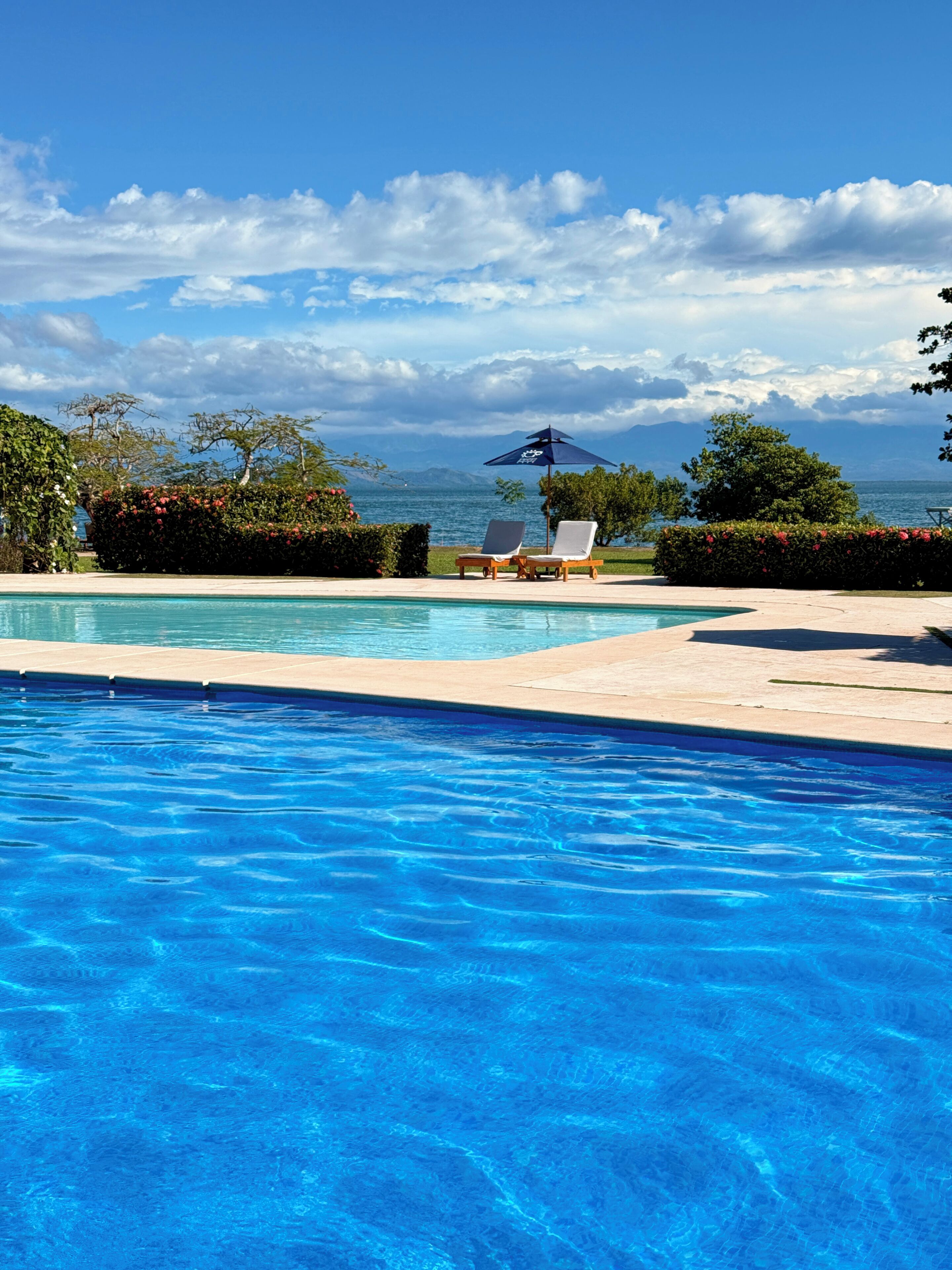 2 outdoor pools, pool umbrellas, pool loungers