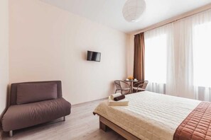 Departamento familiar | Tabla de planchar con plancha, wifi gratis y ropa de cama 