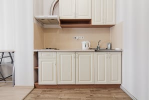 Apartment, 1 Double Bed | Private kitchen | Full-size fridge, stovetop, electric kettle, cookware/dishes/utensils