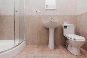 Apartment, 1 Double Bed | Bathroom | Shower, free toiletries, hair dryer, slippers