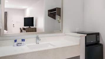 Deep-soaking bathtub, rainfall showerhead, free toiletries, hair dryer