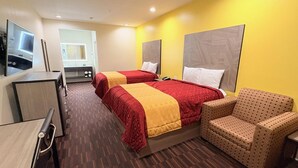 A hotel room with two beds, a desk, a chair, and a television. - Americas Best Value Inn & Suites Houston Veterans Memorial (Houston)