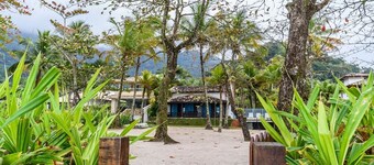 Pé na areia frente ao mar em Guaeca