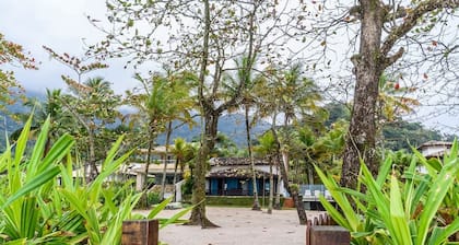 Pé na areia frente ao mar em Guaeca