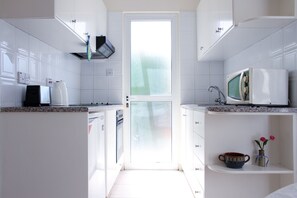 Apartment (5) Ground Floor | Private kitchenette | Full-size fridge, microwave, oven, stovetop - Constantia Gardens Apartments (Paphos)