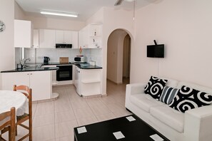 Apartment, Erdgeschoss (4) | Wohnbereich | Flachbildfernseher