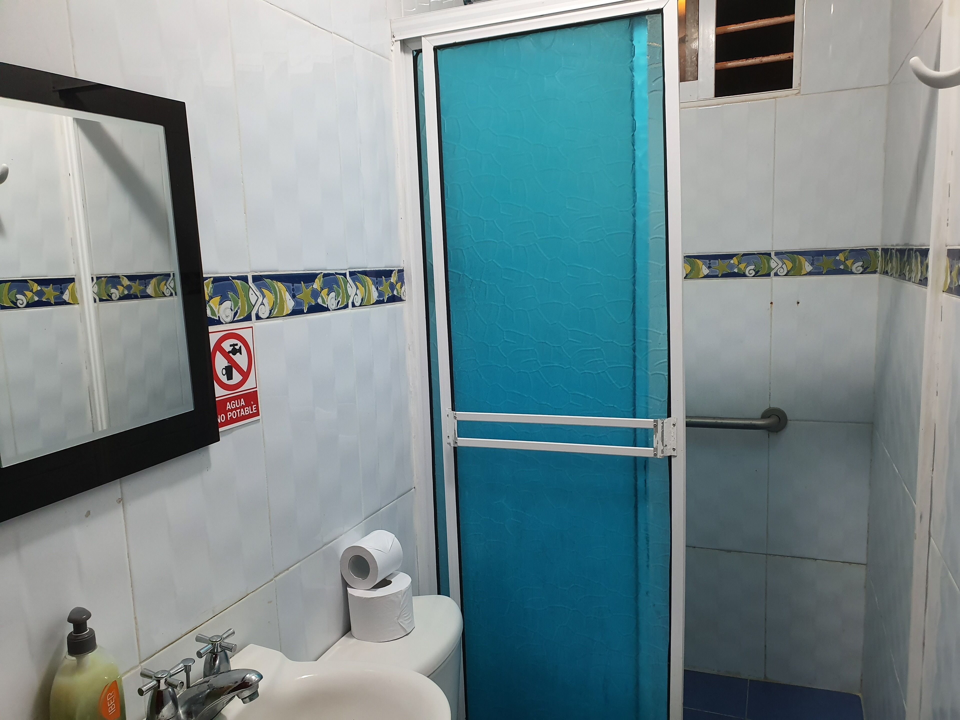 classic quadruple room, multiple beds | bathroom shower