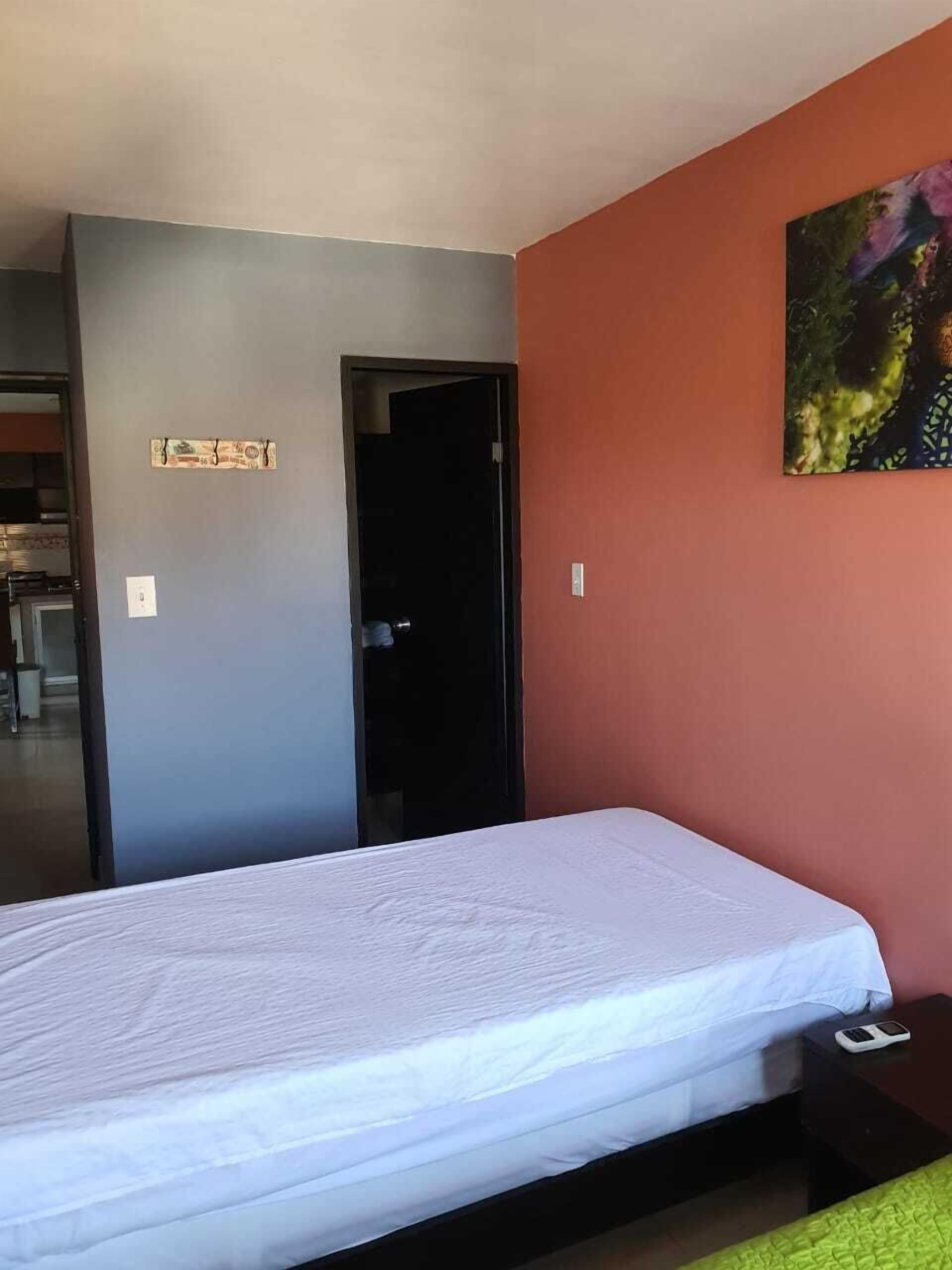 superior apartment, multiple beds, garden view | down duvets, in-room safe, iron/ironing board, bed sheets