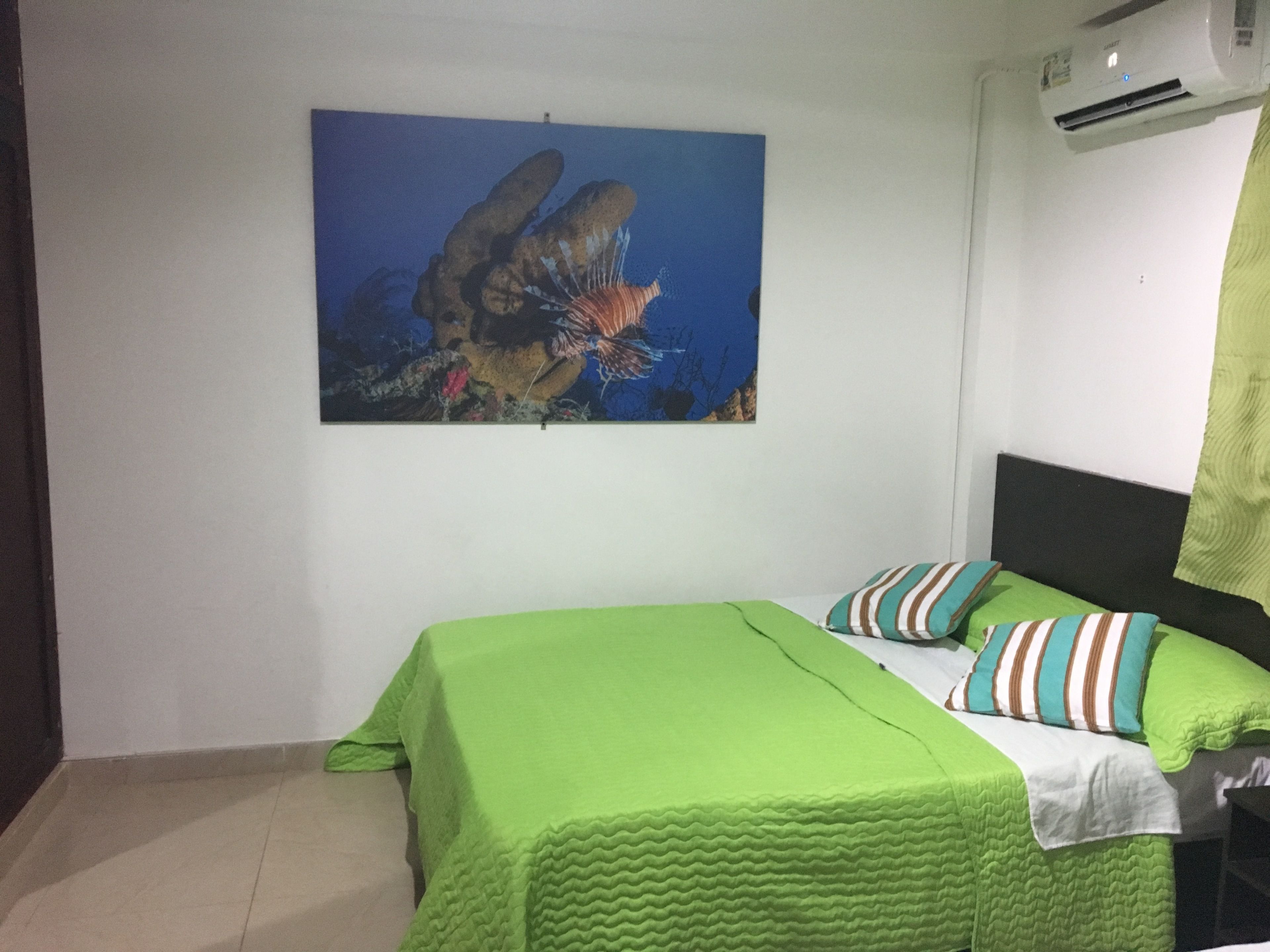 basic triple room, multiple beds, garden view | down duvets, in-room safe, iron/ironing board, bed sheets