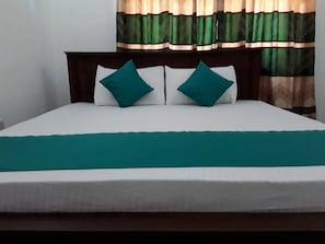 Desk, iron/ironing board, bed sheets