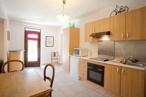 Enjoy cooking in this well-equipped kitchen with a dishwasher, microwave, and stove.