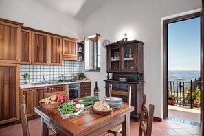 Enjoy home-cooked meals in this well-appointed kitchen, featuring an oven and stove, perfect for cooking up a storm.
