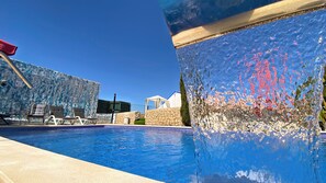 Outdoor pool, pool umbrellas, sun loungers