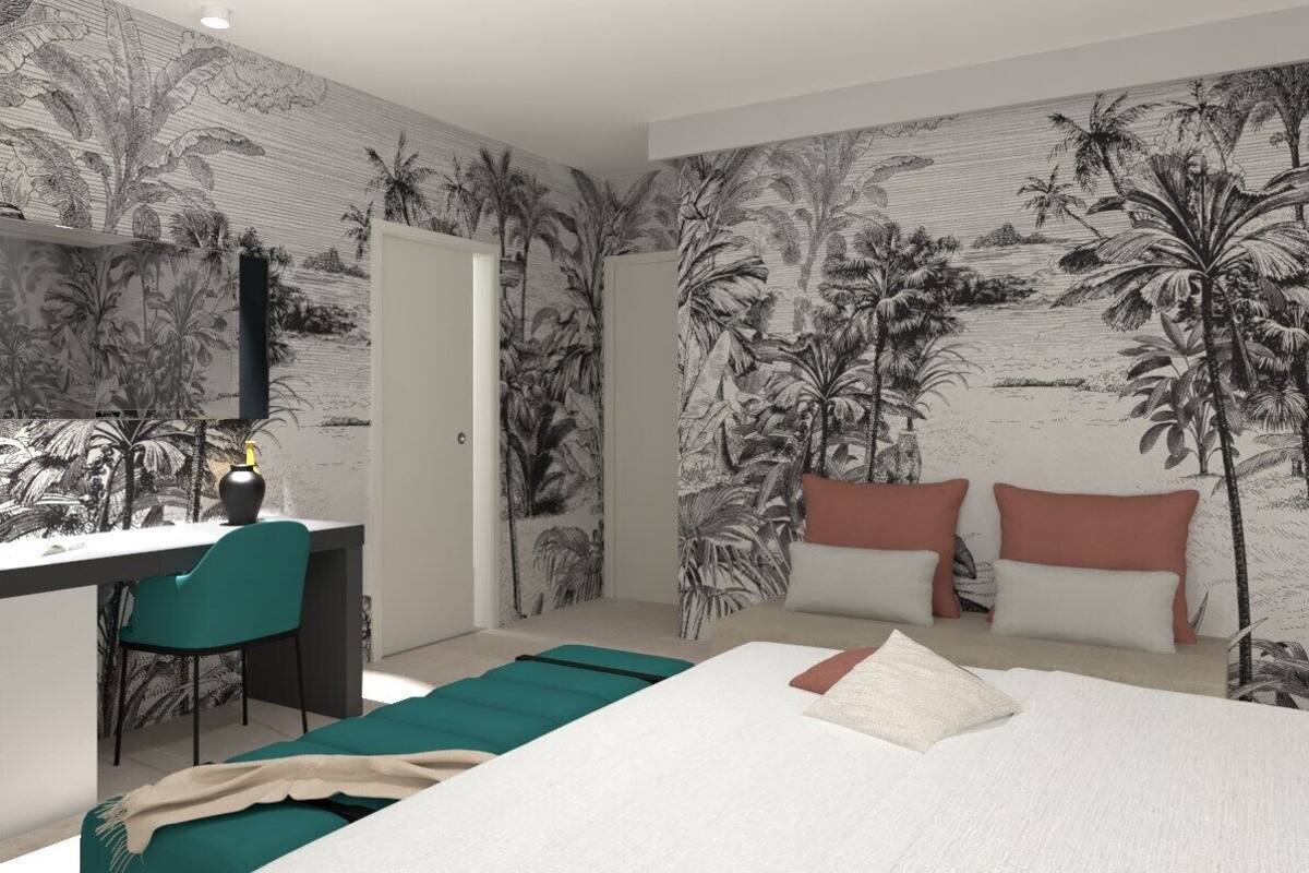 A bedroom with a bed, a desk, and a chair. There is a door and a window.