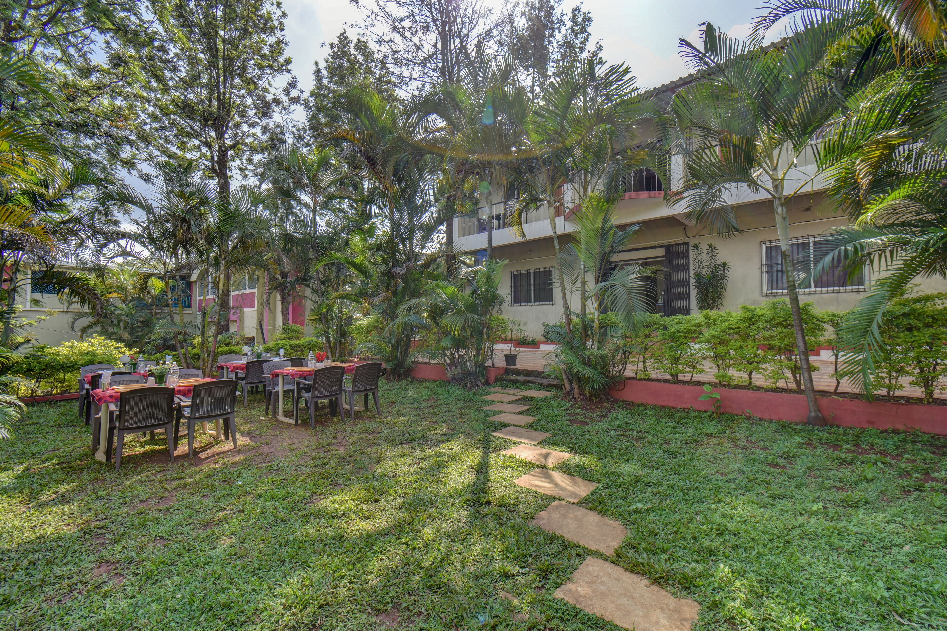 A courtyard with outdoor seating and a pathway.