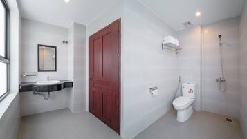 Combined shower/tub, slippers, towels, soap