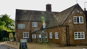 A traditional brick building with a sign reading "The Hollybush Inn." - The Hollybush Inn (Southam)