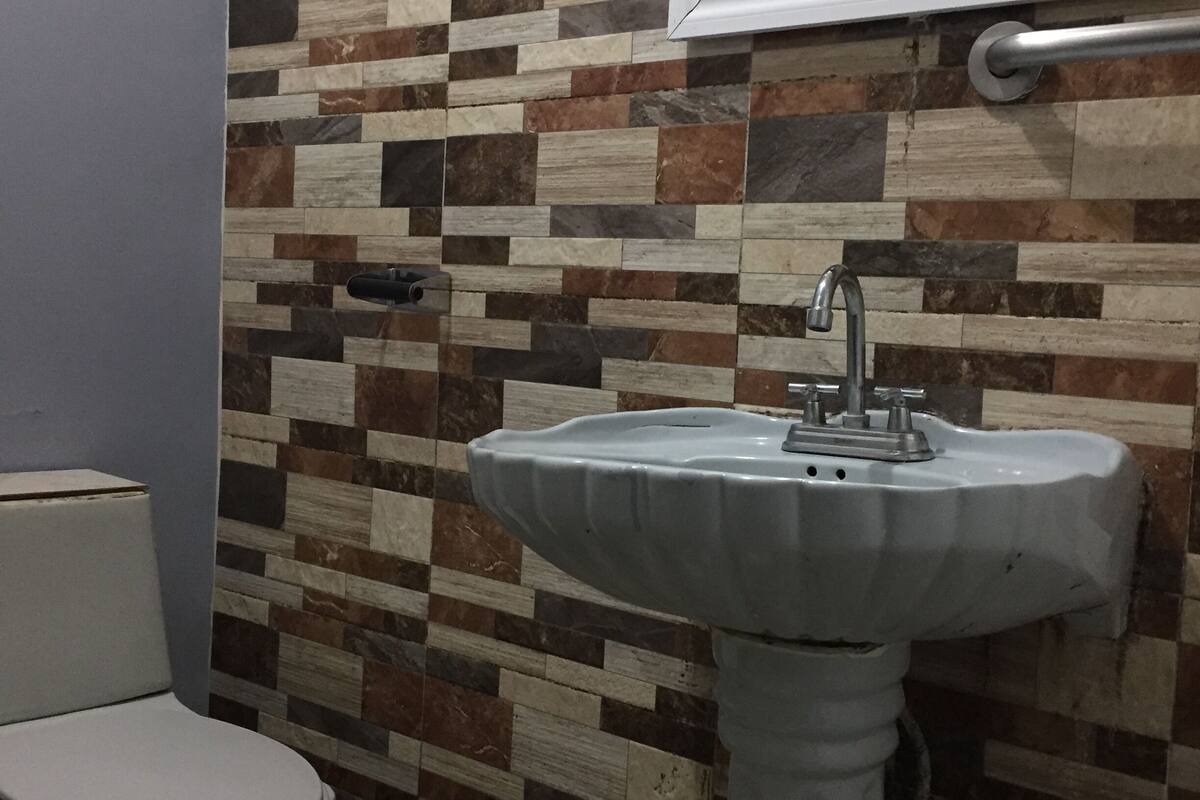 basic quadruple room | bathroom | shower, towels, soap, shampoo