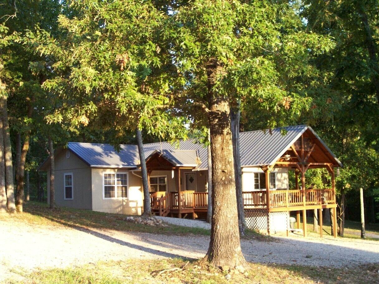 The Ozark Retreat is snuggled in among the oak and hickory trees.