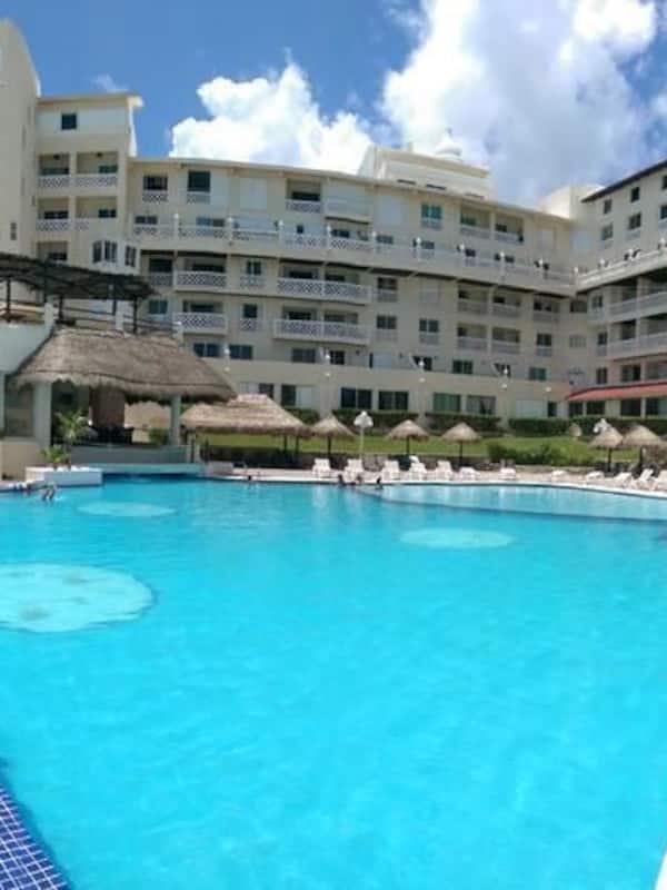 Outdoor pool, open 8:00 AM to 8:00 PM, pool umbrellas, sun loungers