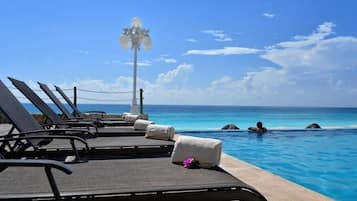 Outdoor pool, open 8:00 AM to 8:00 PM, pool umbrellas, sun loungers