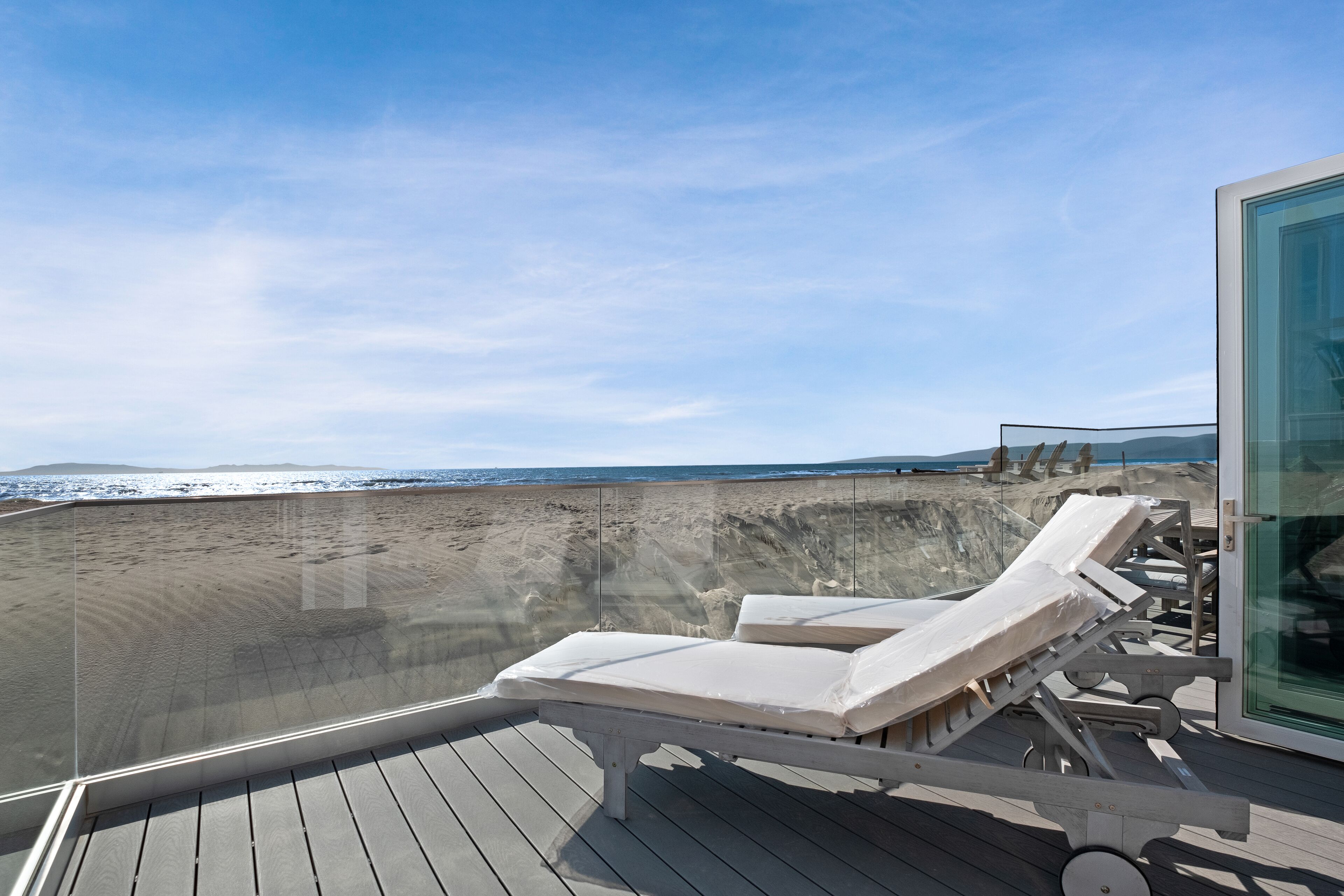 Gorgeous waterfront home with a private hot tub, gas fireplace, & beach access