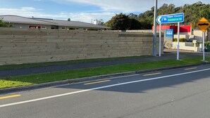 A road with a directional sign for the Town Centre and Commerce St.